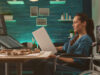 Person working in an agile product management team sitting at a table and working on a project using a digital whiteboard tool