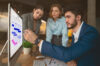 3 people from project management team working on a visual online whiteboard on the Gantt template offered by Conceptboard