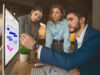 3 people from project management team working on a visual online whiteboard on the Gantt template offered by Conceptboard