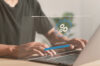 Release Changelog. Person updating the app on his laptop