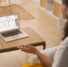 remote collaboration with conceptboard. A person sitting in alone in the room with a laptop and conceptboard open being in a meeting with the team