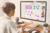 Person working on a Conceptboard board on a project with the team. There are 5 people in a call working on a graph with sticky notes
