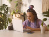 woman working in UX and design editing on her laptop