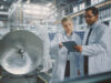 2 people from defence working in a factory for developing defence machinery