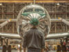 person in front of an airplane in the factory