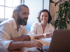 two employees collaborate in modern office